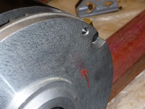 Using a punch to mark bolt holes